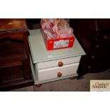 A painted pine bed side chest fitted with two draw