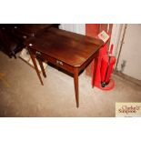 An Edwardian mahogany side table fitted with singl