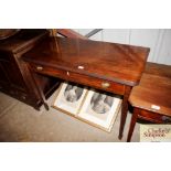 A 19th Century mahogany fold over tea table fitted