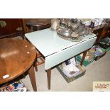 A kitchen drop leaf table