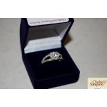 A boxed heart shaped silver and crystal ring marke