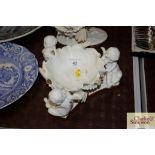 A Minton blanc de chine cherub decorated centre pi