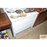 A white painted chest fitted two short over two lo