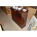 A mahogany open fronted bookcase