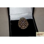 A boxed oval amethyst and 925 marked ring