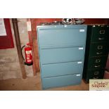 A four drawer metal cabinet