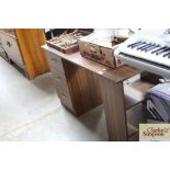 A kneehole dressing table fitted three drawers