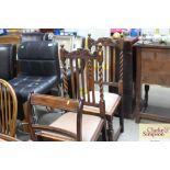 A pair of oak barley twist slat back dining chairs