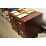 A pair of wood effect filing chests fitted two dra