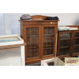 An oak and leaded glazed barleytwist cabinet