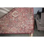 An approx 7'11" x 5'1" floral patterned rug