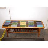 A teak G-plan design coffee table, with coloured t
