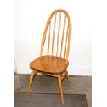 A set of four Ercol stick back dining chairs