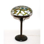 A bronzed Tiffany style table lamp, having mushroo