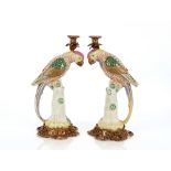 A pair of bronze and porcelain candlesticks, in th