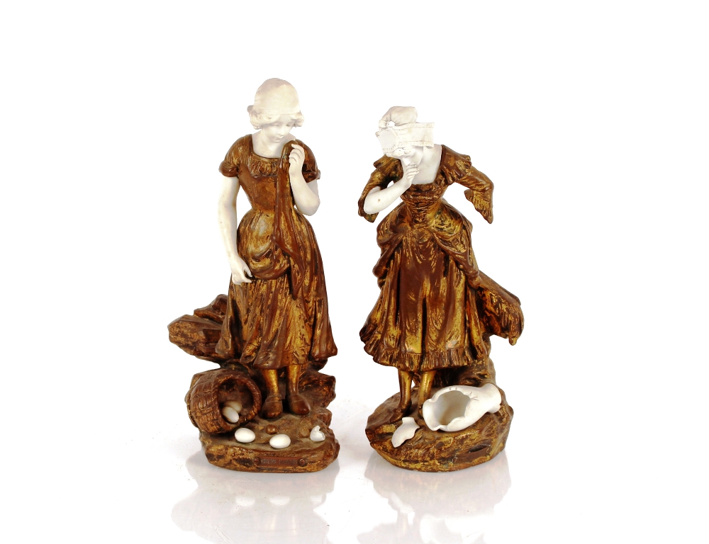A pair of 19th Century gilded metal and bisque por