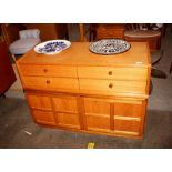 A Nathan side cabinet, fitted four drawers above c