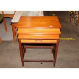 A nest of teak graduated occasional tables, the sm