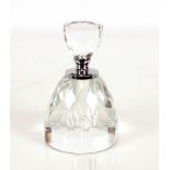 A round glass scent bottle having faceted decorati