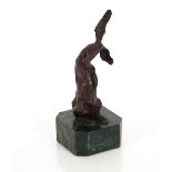 A modernist bronzed figure of a rabbit, raised on