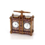 A brass double carriage clock/ barometer with clois