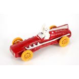 A cast iron Michelin style racing car and figure,