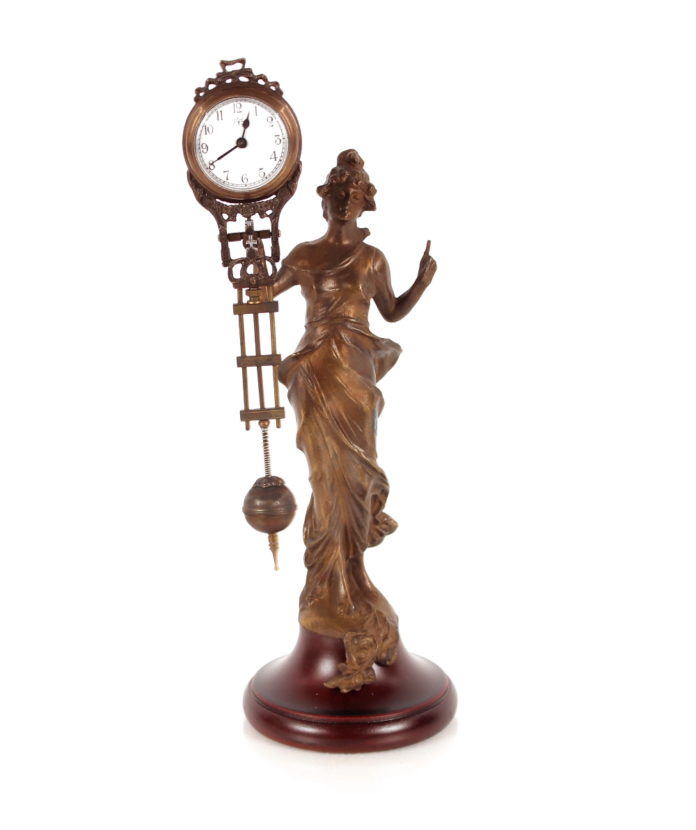 An Art Nouveau style Mystery clock, 30cm high