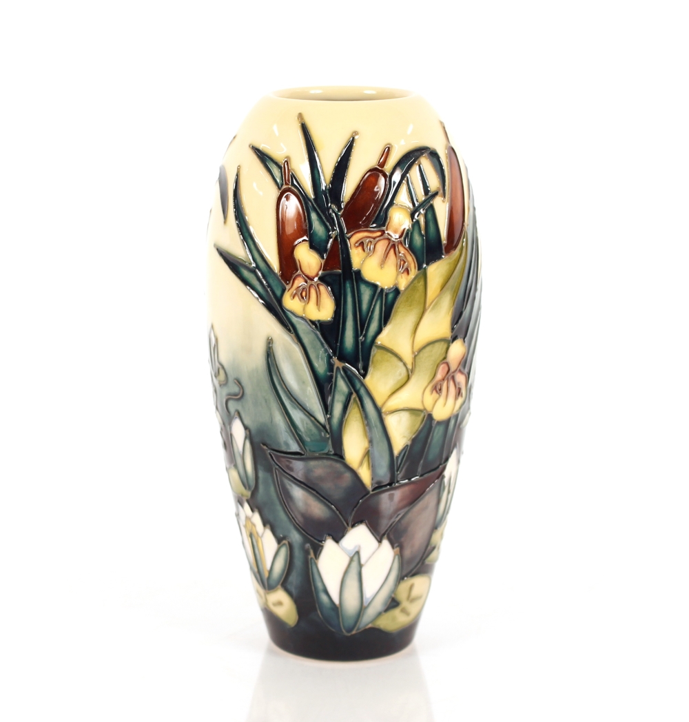 A Moorcroft baluster vase, having raised lily and