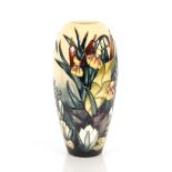 A Moorcroft baluster vase, having raised lily and