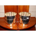 A pair of silver plated barrel shaped wine coolers