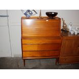 A 1960's teak bureau, the fall front compartment r