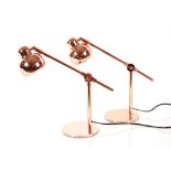 A pair of copper adjustable table lamps