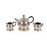 A plated Art Deco design three piece tea set