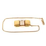 A yellow metal plated purse watch, by Laco hung to