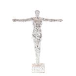 A decorative silvered figure of a gymnast, arms ou