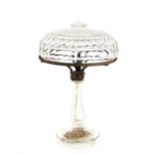 A glass table lamp, having mushroom shade and face