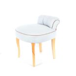 A light blue upholstered dressing table chair, rai