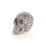 A decorative silvered and diamanté style skull orn