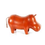 A tan leather Hippo stool, 57cm long overall, 31cm