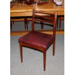 A set of four teak 1970's ladder back dining chair