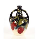 A Moorcroft "Raspberry" decorated twin handled bal