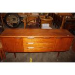 A teak G-plan style sideboard, fitted three centra