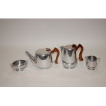 A four piece stainless steel Picquot tea set
