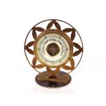 A brass Art Deco desk barometer