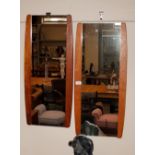 A pair of teak G-plan style wall mirrors, 78cm x 36cm