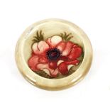 A W Moorcroft circular pin dish, with floral decor