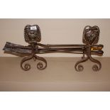 A pair of brass and steel Art Nouveau design imple