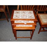 A nest of three teak tile top coffee tables, 55.5c