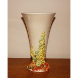 A Clarice Cliff, Newport Pottery vase with raised