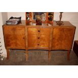 A good quality walnut serpentine fronted sideboard